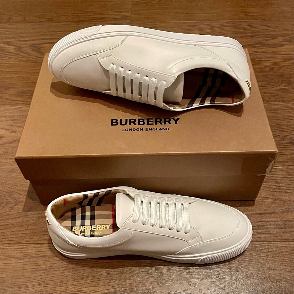 New in box Burberry white leather sneakers with gold tone logo and check lining